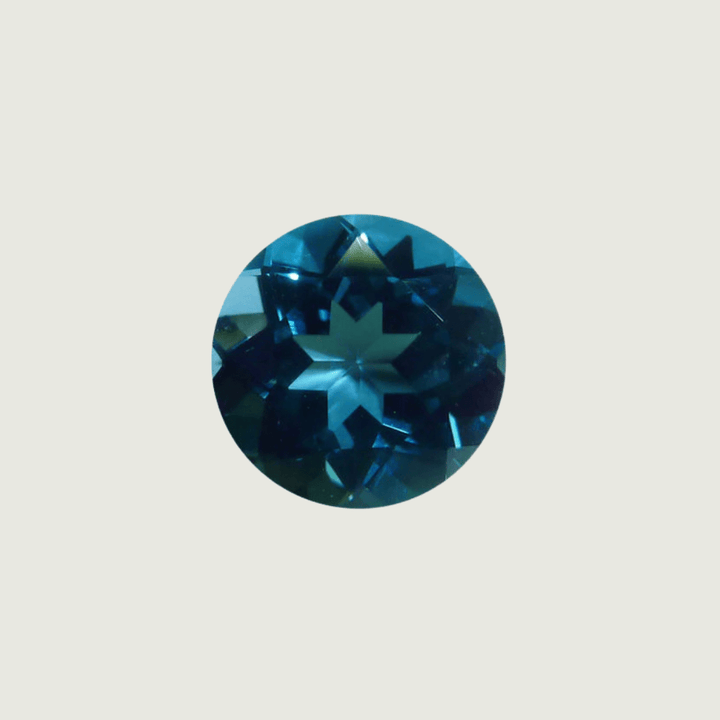 Mathieu Blanchard Topaze Naturel Bleu London Taille brillant rond 6 mm