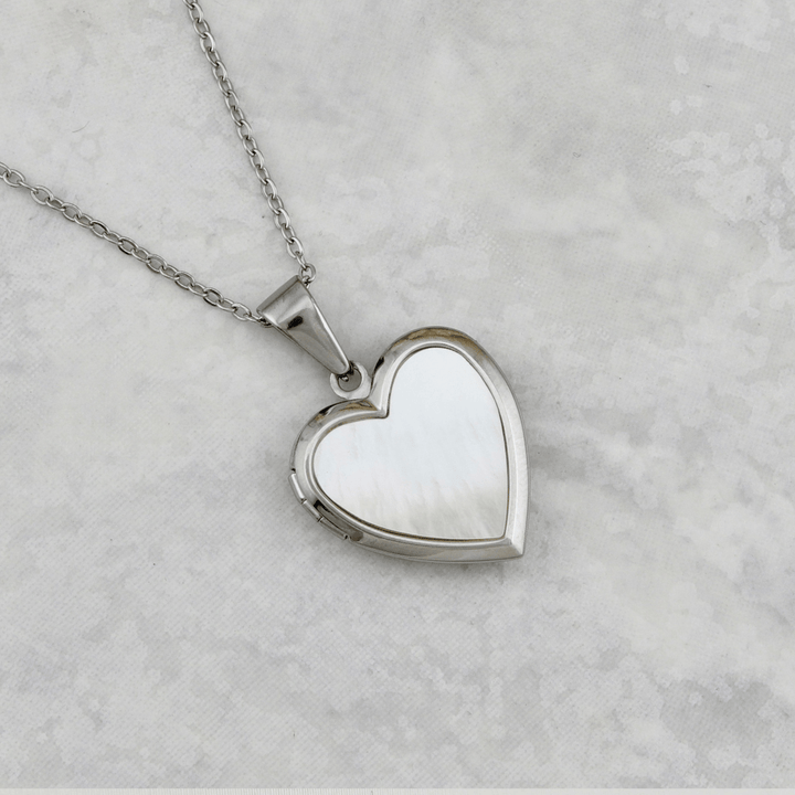 Collier porte photos Cœur en acier inoxydable Mathieu Blanchard Pendants Acier inoxydable PCOAM14182S Collier porte-photos Coeur en nacre de perle en acier inox Mathieu Blanchard Joaillerie