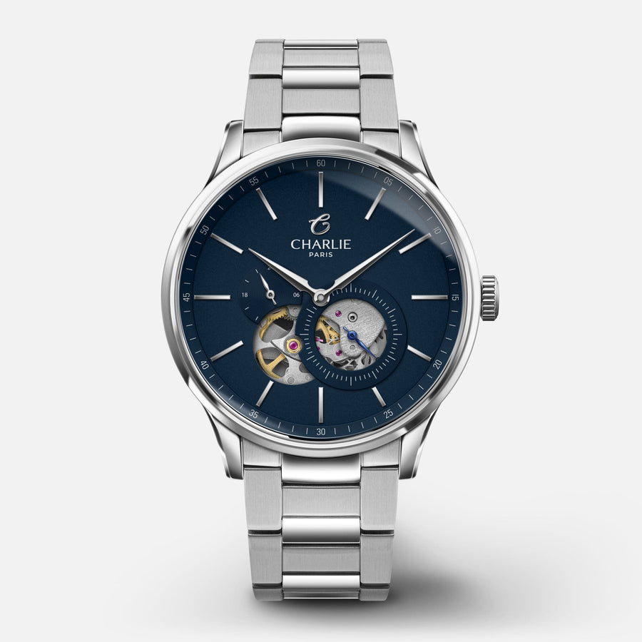 Montre Charlie Paris INITIAL Open Heart Bleu 40 mm en acier inoxydable Charlie Paris Montre 3-link stainless steel / Acier inoxydable ICO-40-009 / B-ICO / m-ICO Montre Charlie Paris INITIAL Open Heart - Bleu 40 mm | Dépositaire Officiel Canada | Mathieu Blanchard Joaillerie Mathieu Blanchard Joaillerie