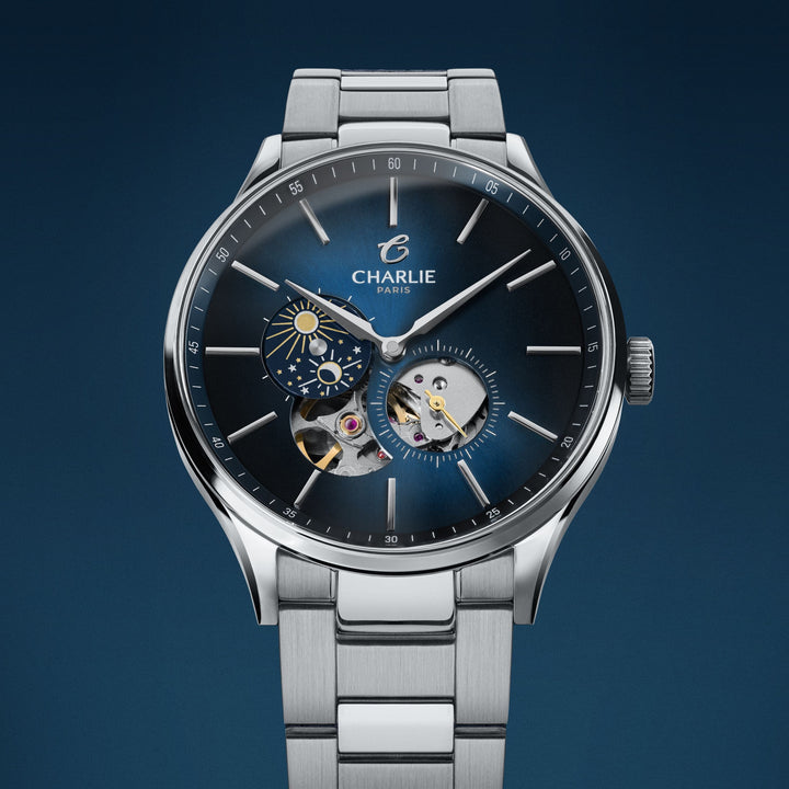 Montre Charlie Paris INITIAL Open Heart Jour/Nuit Bleu 40 mm en acier inoxydable Charlie Paris Montre Montre Charlie Paris INITIAL Open Heart Jour/Nuit - Bleu 40 mm | Dépositaire Officiel Canada | Mathieu Blanchard Joaillerie Mathieu Blanchard Joaillerie